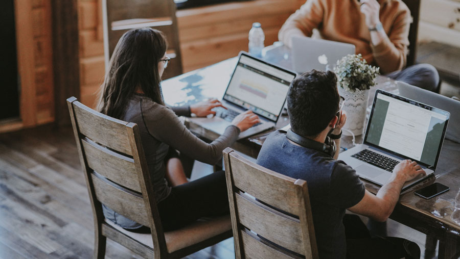 3 people working together in a coffee shop